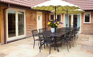 Ramscombe - A big patio table to seat 14 is great for barbecue and alfresco dining