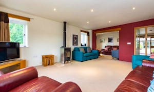 Showing the lounge and sung areas at Orchard House, with lots of seating large self catering accommodation - www.bhhl.co.uk