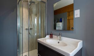 Corner shower unit, large mirror and heated towel rail at Orchard House  10 bedroom holiday accommodation - www.bhhl.co.uk
