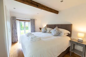 Pippinsands, Stonehayes Farm - On the ground floor, Bedroom 6 has French doors that open onto the garden