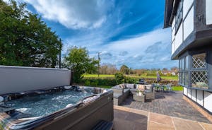 Luntley Court: Relax in the hot tub with views over the fields