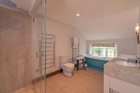 Perys Hill - The Farmhouse: Bedroom 1 has an ensuite bathroom with a free standing bath and separate shower