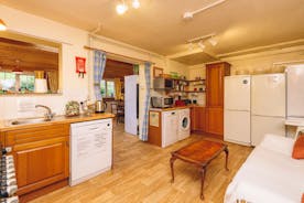 Both kitchens have Range cookers, and include; 4 large fridge freezers, washing machine, tumble drier, 2 microwaves and a slow cooker.