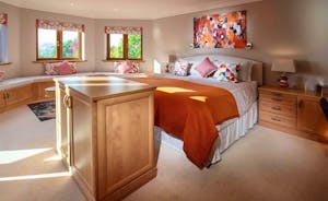 Hamble House - Bedroom 3 is a suite with a superking bed, comfy seating area, en suite bathroom and private balcony