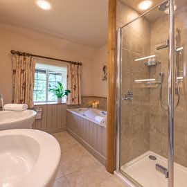 Lower Leigh - Edwardian ensuite bathroom with a bath, shower and two handbasins Lower Leigh - Edwardian ensuite bathroom with a bath, shower and two handbasins