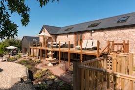 Foxhill Lodge - Put your feet up on the loungers up on the veranda - views and sunshine