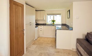 Holemoor Stables: The annexe kitchen, with a fridge-freezer, kettle and microwave