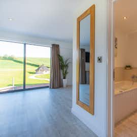 The Granary - The ensuite bathroom for Bedroom 7 has a bath and separate shower The Granary - The ensuite bathroom for Bedroom 7 has a bath and separate shower