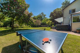 Babblebrook - The gardens are idyllic, with a hot tub, outdoor table tennis, lawn games and a river running along the boundary