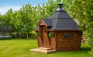 Herons Bank - In the garden there's a cosy Scandi style BBQ lodge for year round use