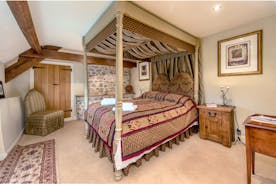 Lower Leigh - The Medieval bedroom has exposed stone walls and a four poster bed