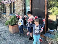 Jubilee bunting with grandchildren helping pin it up