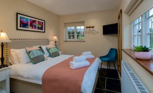 Pink Thatch - Bedroom 5: A ground floor room with a double bed