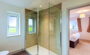 Orchard View - Bedroom 1: A roomy contemporary en suite shower room