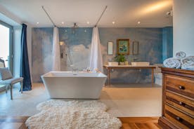 Tides Reach - The ensuite bathroom for Bedroom 5 has a free standing bath and a separate wet area