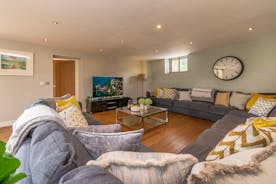 Coat Barn - Cosy up on the enormous sofa in the living room for a family movie night