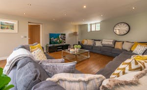 Coat Barn - Cosy up on the enormous sofa in the living room for a family movie night