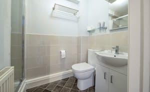 A modern en suite shower room at Forest House, an 11 bed holiday house in Coleford, Forest of Dean - www.bhhl.co.uk