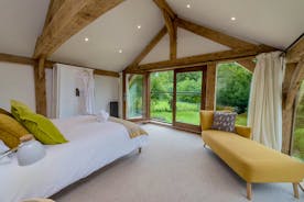 Otterhead House - Bedroom 1: Soaring timbers, breathtaking views