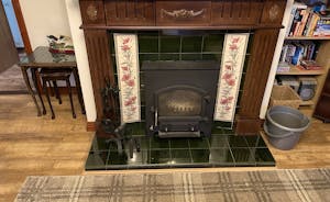 Cottage has an effective log stove and modern Dimplex Quantum night storage heaters 