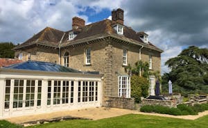 View of house and orangery from enclosed garden