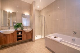 The Old Rectory - The Stannard Suite has a more modern ensuite bathroom with a bath and separate shower