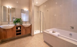 The Old Rectory - The Stannard Suite has a more modern ensuite bathroom with a bath and separate shower