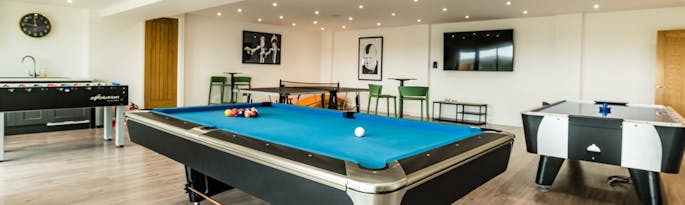 Churchill-games-room-with-pool-table-and-tv-for-spending-time-together