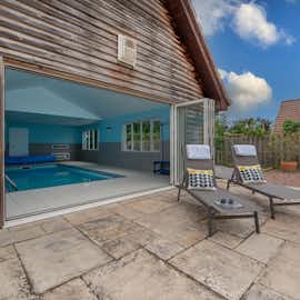 Ramscombe: Bi-fold doors bring the sunshine into the pool room Ramscombe: Bi-fold doors bring the sunshine into the pool room