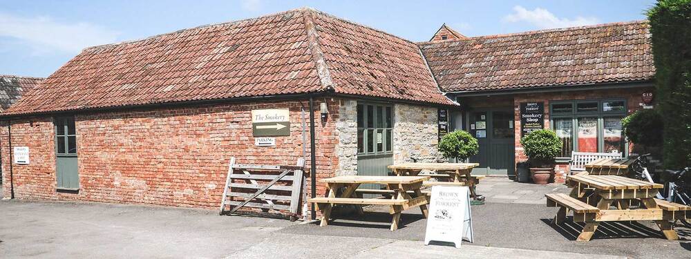 Brown and forest smokery restaurant front entrance