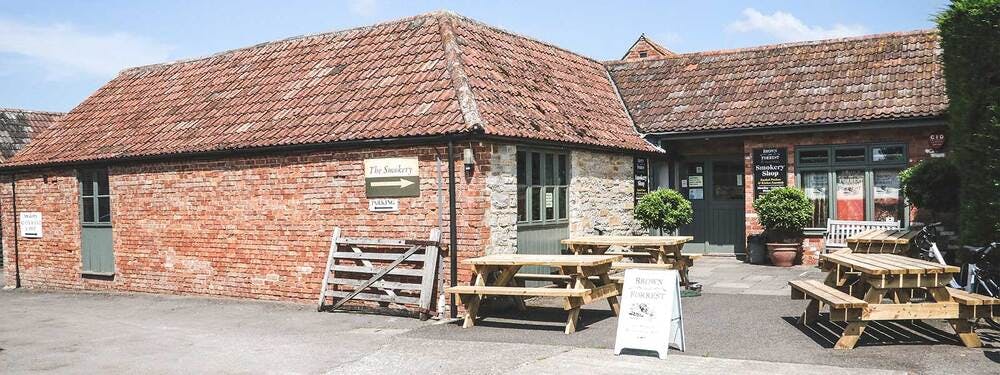 Brown and forest smokery restaurant front entrance