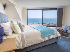 Master bedroom with king sized bed and sea views