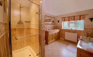 Garden Court - Bedroom 1 has an en suite bathroom with a bath and walk-in shower