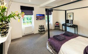 Pitmaston House - Bedroom 2 is a double room with a contemporary four poster bed, and an en suite bathroom with a separate shower