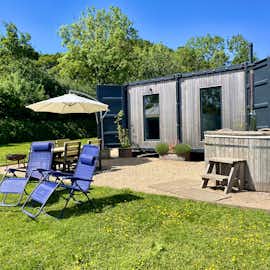 Outside seating area and hot tub.  Outside seating area and hot tub.