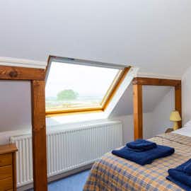 Feature windows in a double room High Cloud Farm and Barn self catering holiday accommodation  Welsh county side www.bhhl.co.uk Feature windows in a double room High Cloud Farm and Barn self catering holiday accommodation  Welsh county side www.bhhl.co.uk