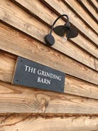 The Grinding Barn sign