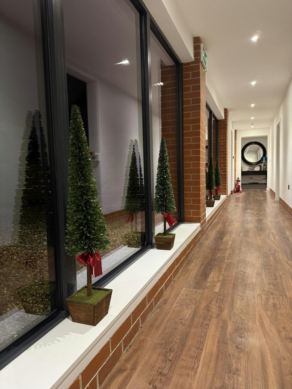 The hallway in Churchill showing miniature Christmas trees in the windows