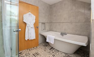 Wayside: The main bathroom has a contemporary free standing bath as well as a separate shower