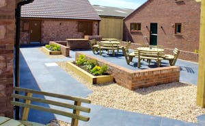 Quantock Barns - All barns are accessed via a paved courtyard, with outdoor seating and a big built in barbecue