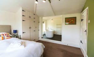 The Benches - Bedroom 2 has an open-plan en suite bathroom with a free standing bath.