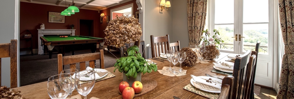 Dining room looking through to the games room with snooker table 