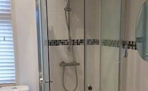 First Floor Apartment Shower with WC and Storage cupboard 