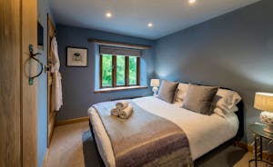 Otterhead House - Bedroom 2: A double bed, calm muted tones
