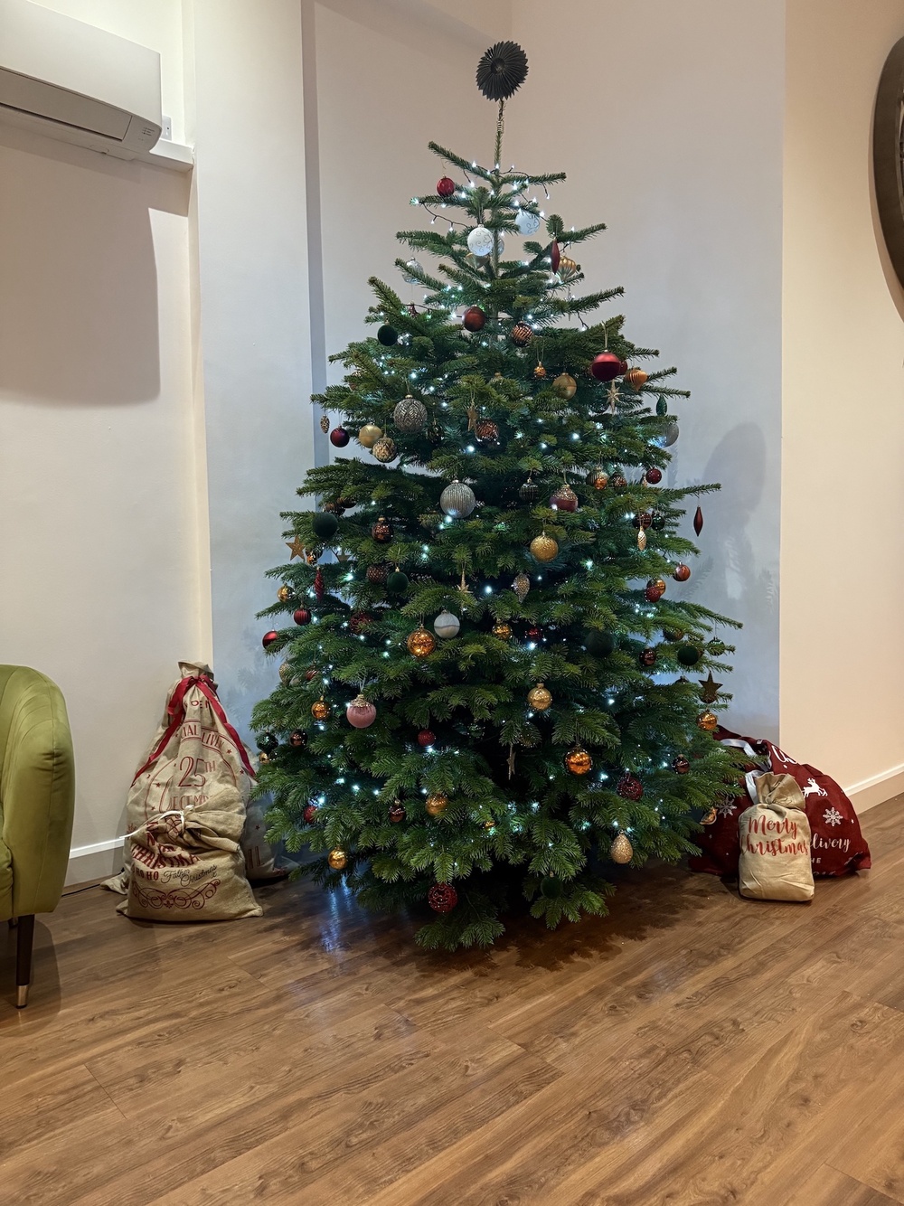 Christmas tree in the kitchen and living area at Churchill holiday home