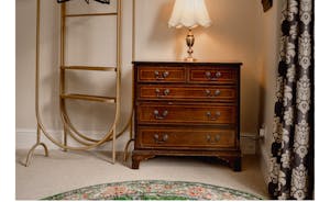 Vintage drawers in king bedroom