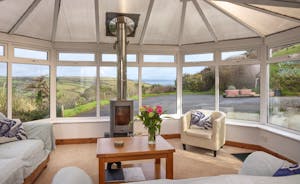 Conservatory with woodstove and sea view