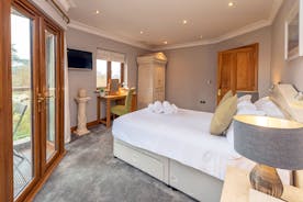 Hamble House - Bedroom 2 has a double bed, an ensuite shower room, and its own balcony