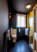 Striking black and yellow shower room with walking in shower self catering holiday accommodation Monmouthshire www.bhhl.co.uk