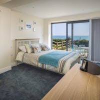Bedroom 3 with access to garden and sea views Bedroom 3 with access to garden and sea views
